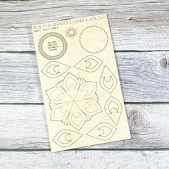 Wooden template with rangoli design on a wooden surface