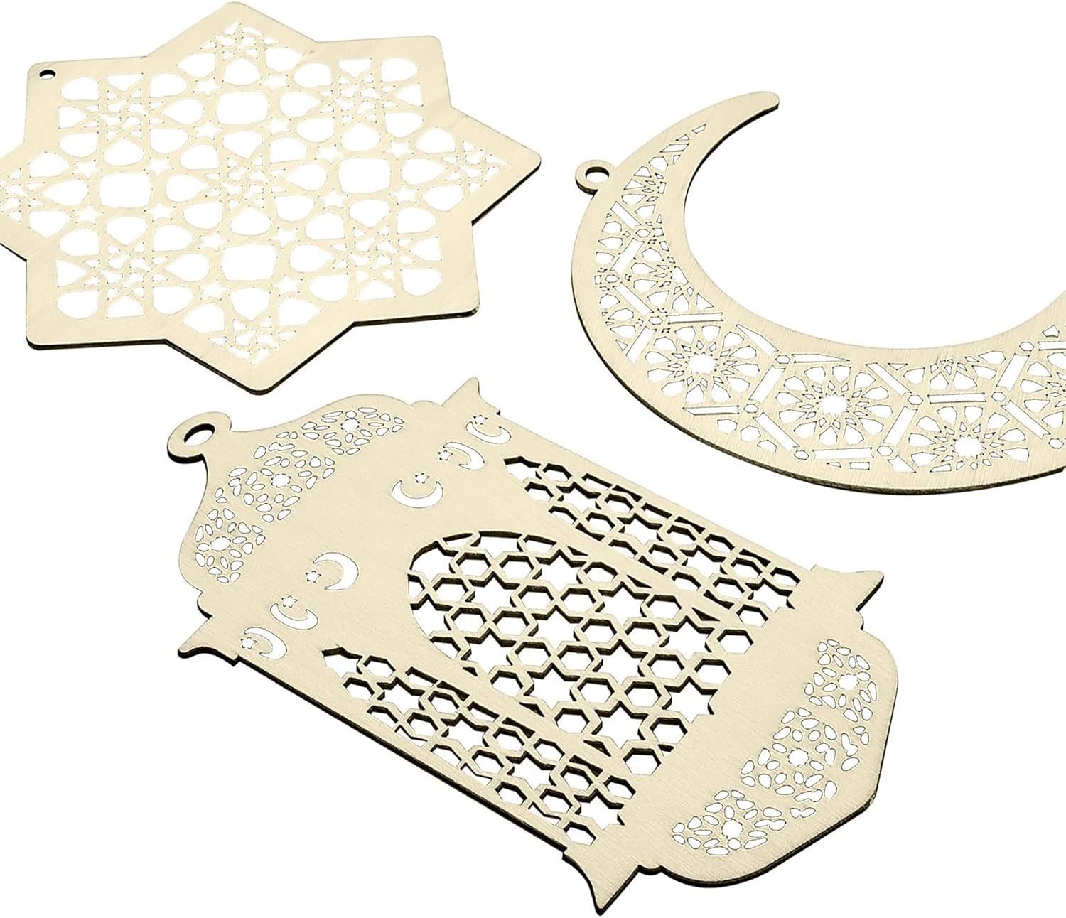 Decorative wooden cutouts shaped like a star, crescent moon, and rectangular design on a white background.