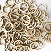 Pile of wooden rings on a white background
