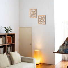 Living room with a sofa, bookshelf, and decorative wall art