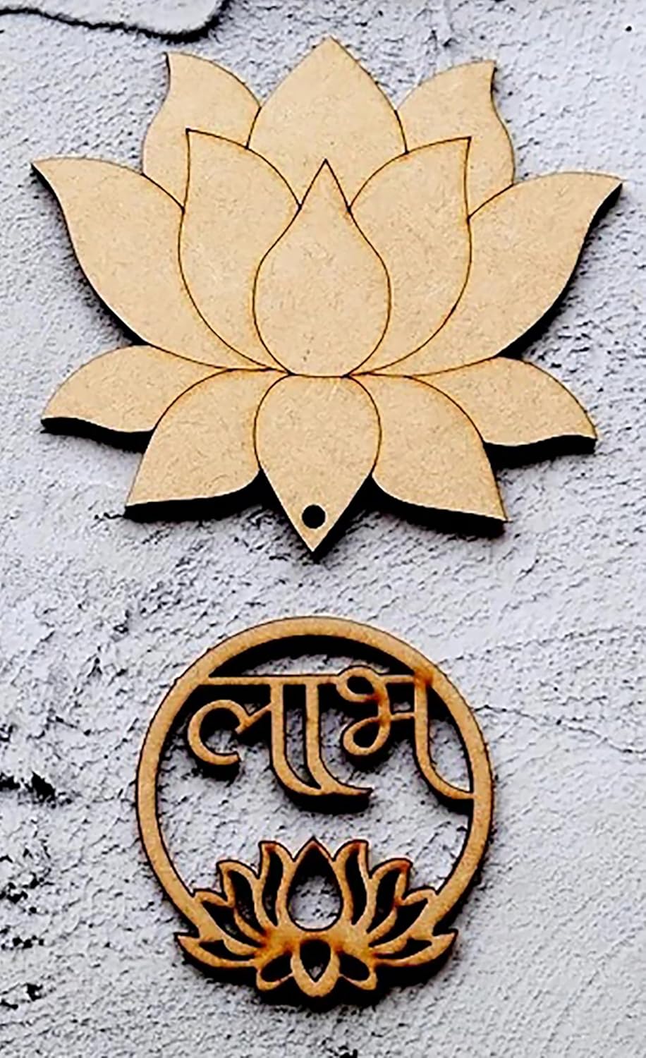 Two wooden lotus flower designs on a textured surface