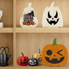 Halloween-themed decorative items on a wooden shelf