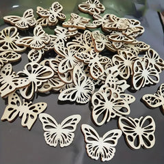 Wooden butterfly shapes on a reflective surface