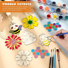 Wooden cutouts with paint and brushes on a wooden surface