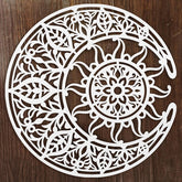 Decorative white cutout with intricate patterns on a wooden background