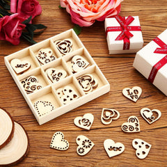 Wooden heart-shaped stamps in a box with decorative ribbons and flowers on a wooden surface