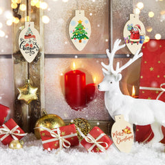 Decorative Christmas scene with reindeer, candles, and ornaments on a snowy background.