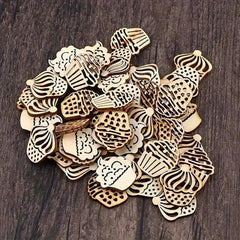 Collection of wooden cupcake-shaped cutouts on a dark wooden surface