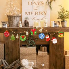 Decorative Christmas mantel with festive ornaments, candles, and a 'Merry' sign.