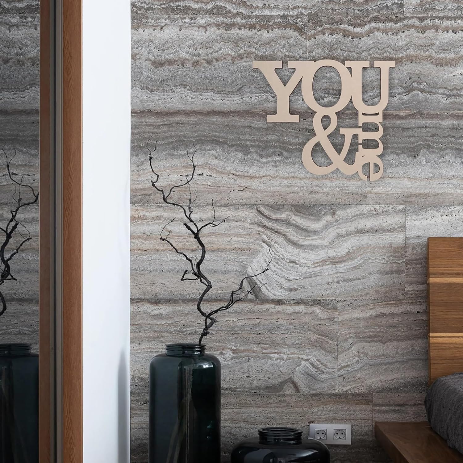 Decorative wall art with 'YOU & I' on a marble-patterned wall.