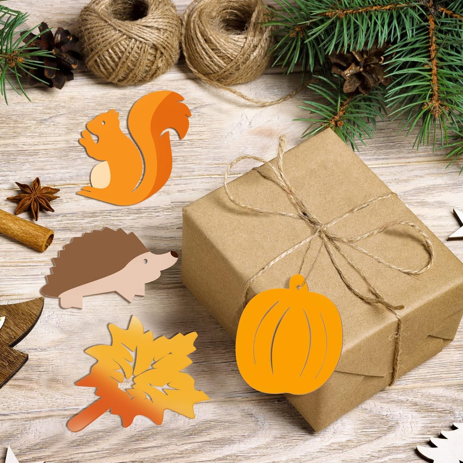 Gift box wrapped in brown paper with decorative cutouts on a wooden surface