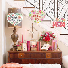Decorative setup with 'Happy Mother's Day' and 'Mom' signs on a staircase.