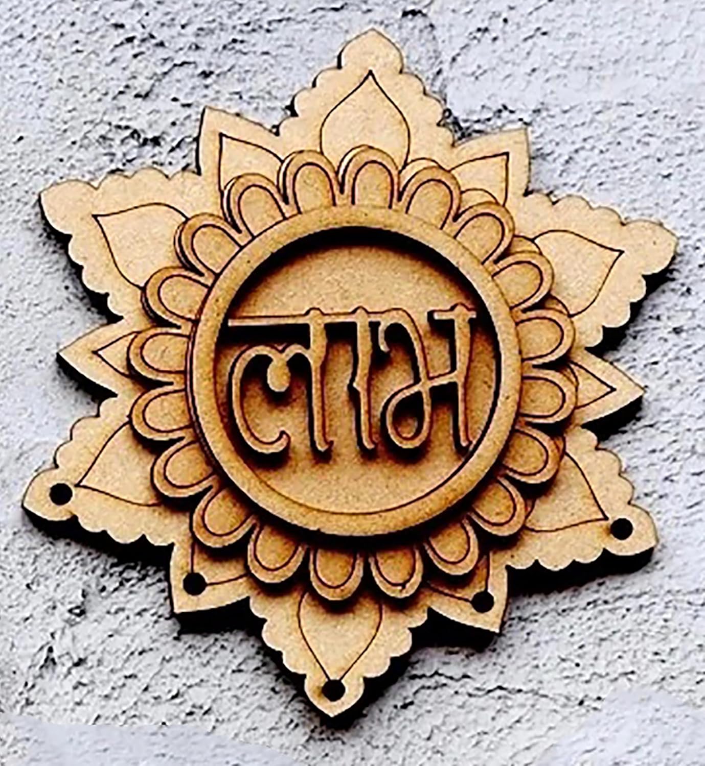 Wooden decorative item with intricate design and text on a textured wall background