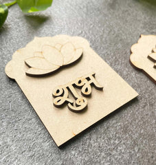 Wooden nameplate with decorative elements on a gray surface
