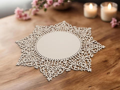 Decorative lace doily on a wooden surface with candles and flowers in the background