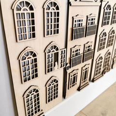 Wooden architectural model with detailed windows on a white background