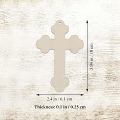 Beige cross-shaped pendant with measurements on a light wood background