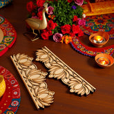 Decorative wooden items on a table with flowers and candles