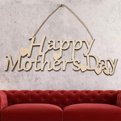 Wooden 'Happy Mother's Day' sign hanging above a red sofa against a textured wall.