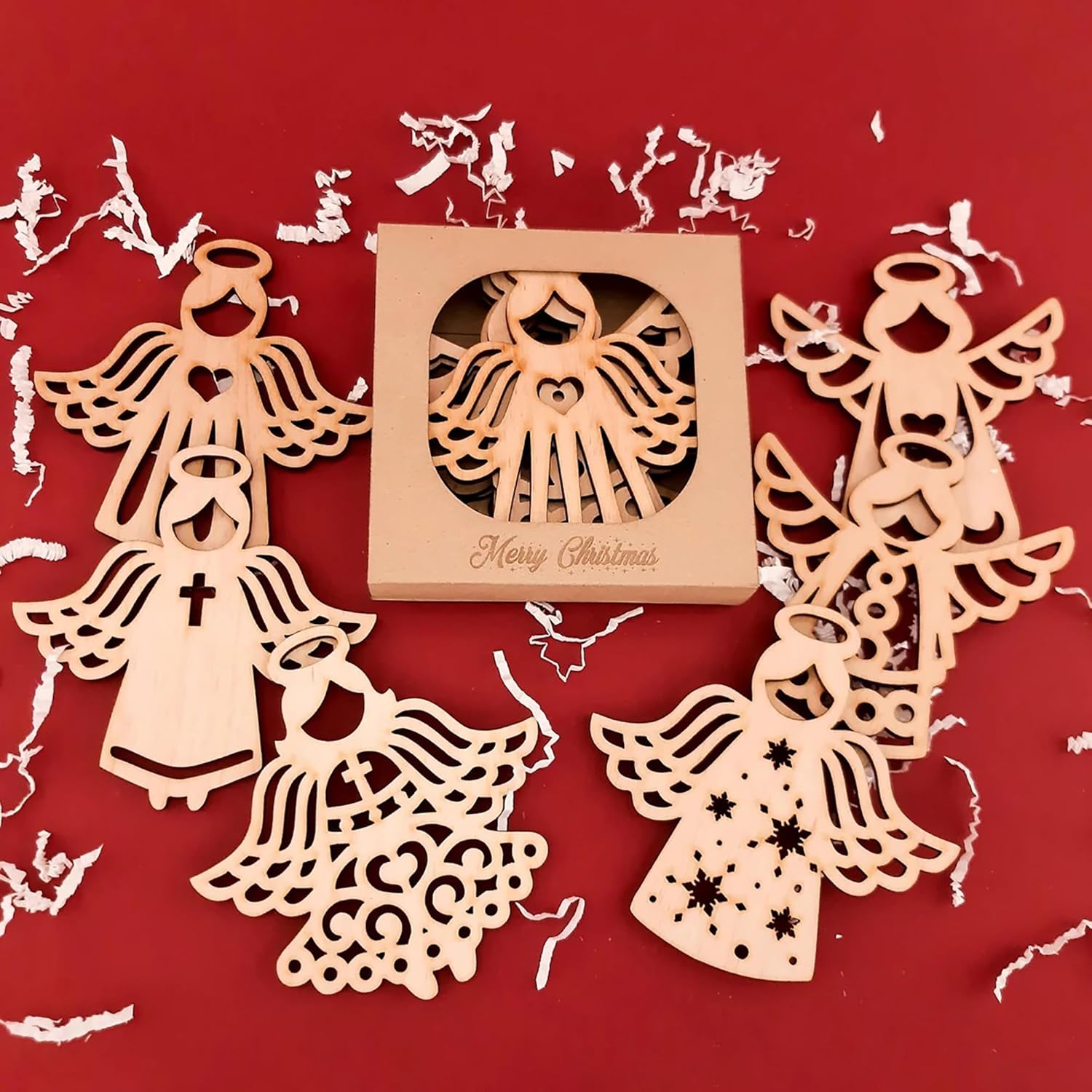 Wooden angel ornaments on a red background with 'Merry Christmas' text.