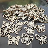 Wooden butterfly decorations on a reflective surface