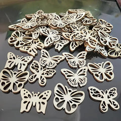 Wooden butterfly decorations on a reflective surface