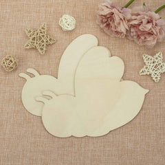 Wooden leaf-shaped cutting on a textured fabric background with decorative elements.
