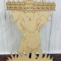 Wooden cutout of a deity with multiple faces on a wooden background