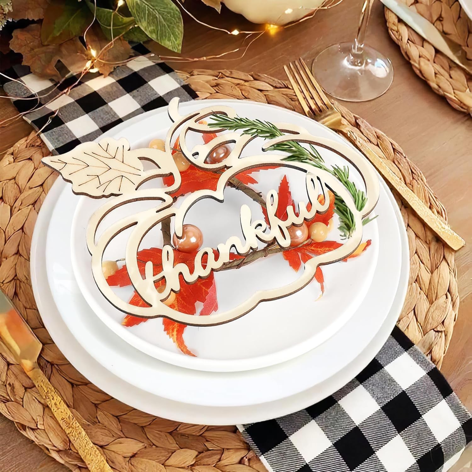 Decorative plate with 'Thankful' text and leaf design on a table setting.