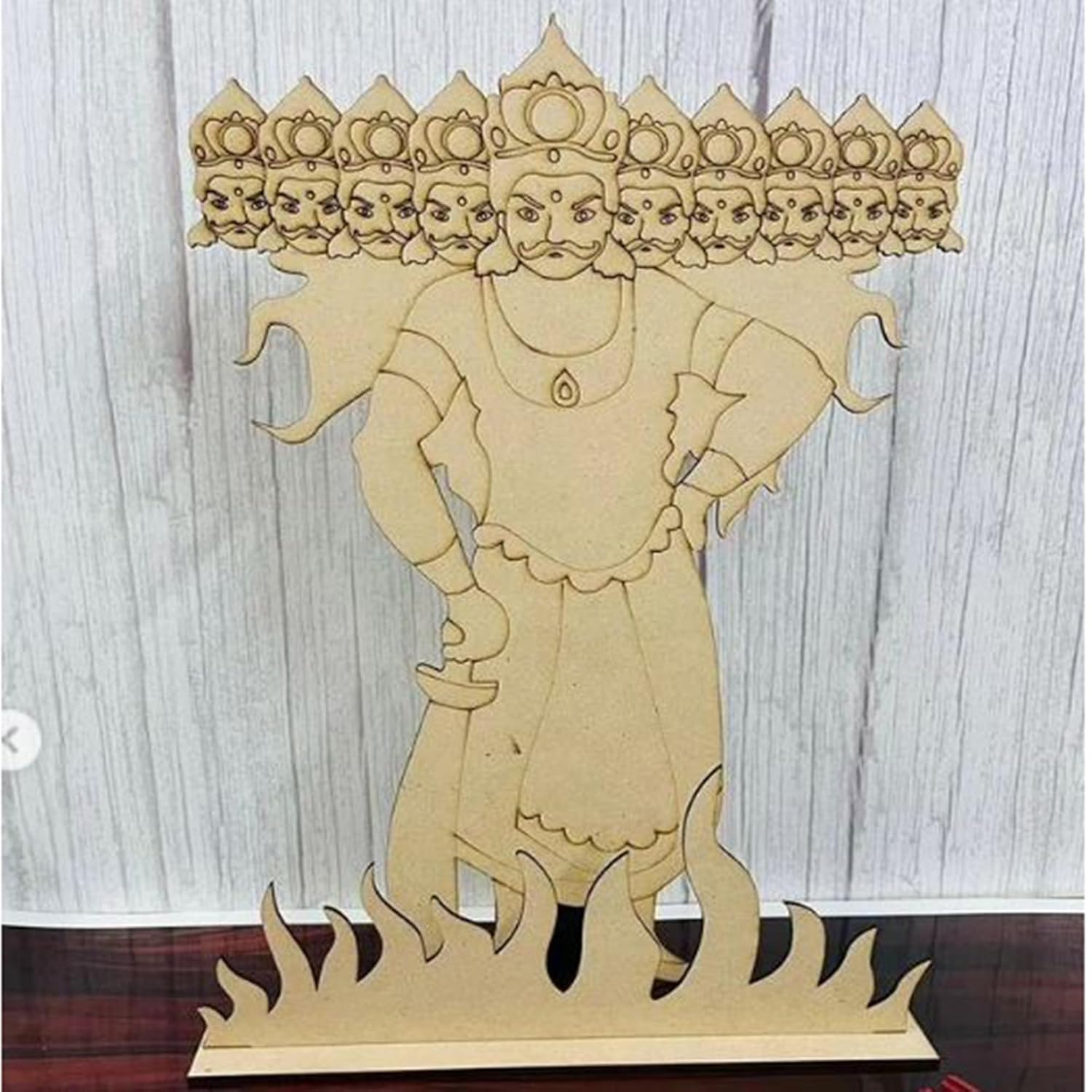 Wooden sculpture of a deity with intricate details on a wooden stand