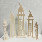 Set of four beige decorative towers with intricate patterns on a light gray background