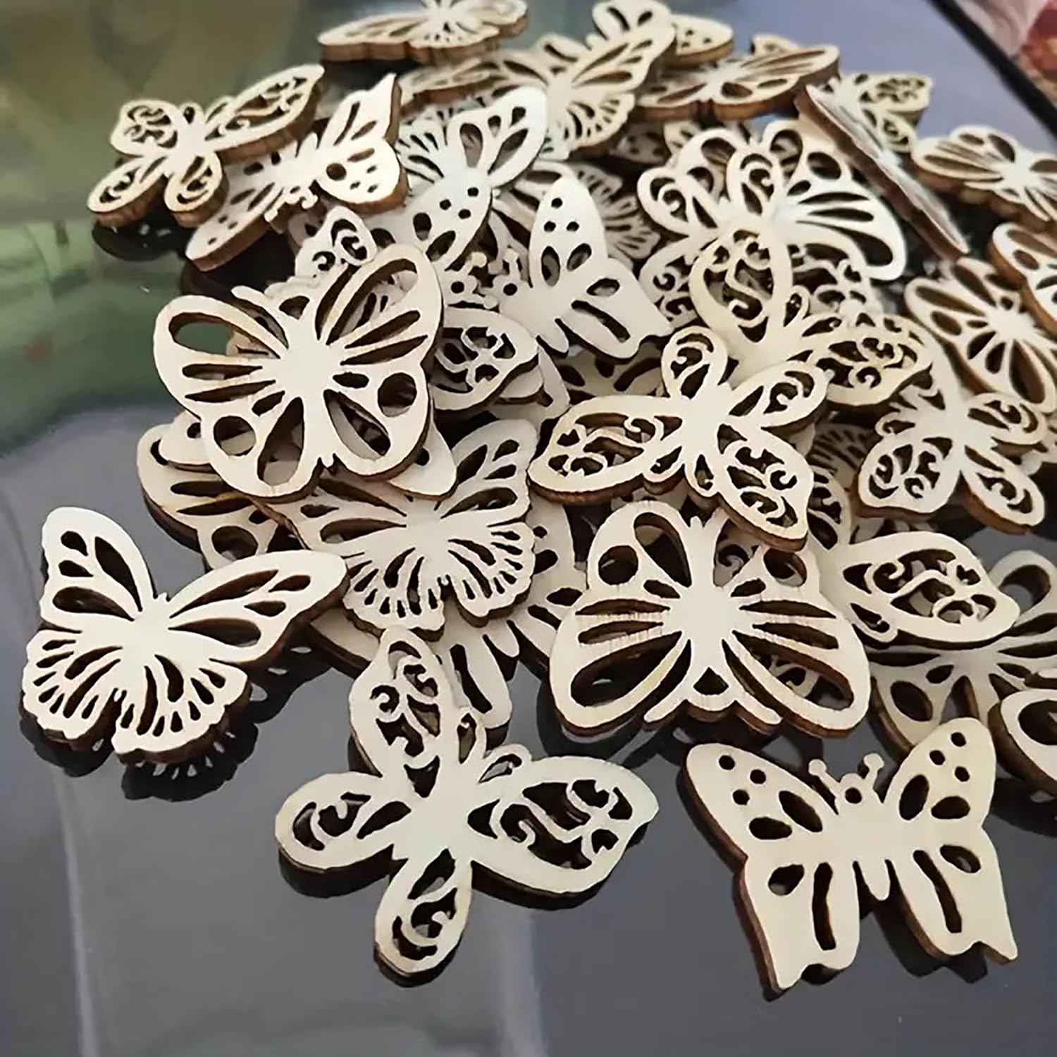 Wooden butterfly decorations on a reflective surface