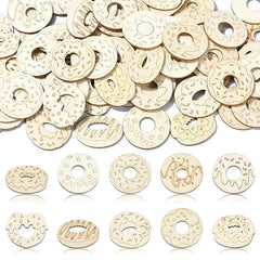 Wooden donut-shaped cutouts with various designs on a white background