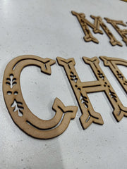 Decorative wooden letters 'M', 'C', and 'H' on a light gray background
