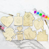 Wooden decorative pieces with various designs on a marble surface.