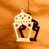 Decorative lantern ornament with star patterns on an orange background