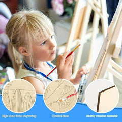 Child painting with a brush, surrounded by wooden boards with laser engraved designs.