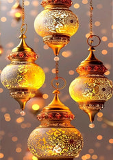 Decorative gold lanterns with intricate designs against a bokeh background