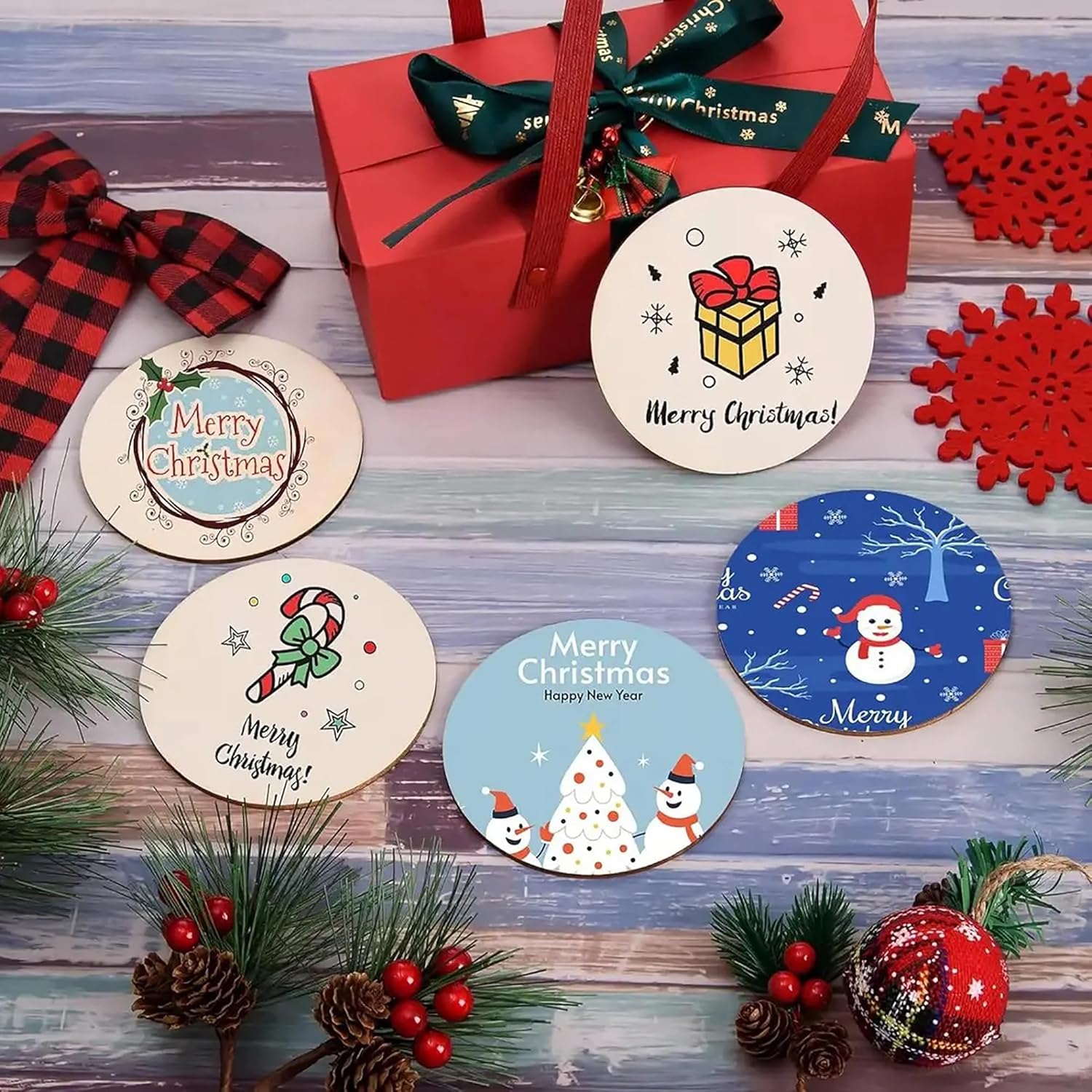 Set of Christmas-themed coasters with decorative elements on a wooden surface.