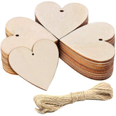 Wooden heart-shaped tags with twine on a white background