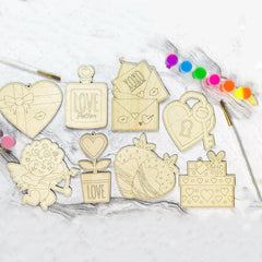 Wooden decorative elements with various designs on a white surface