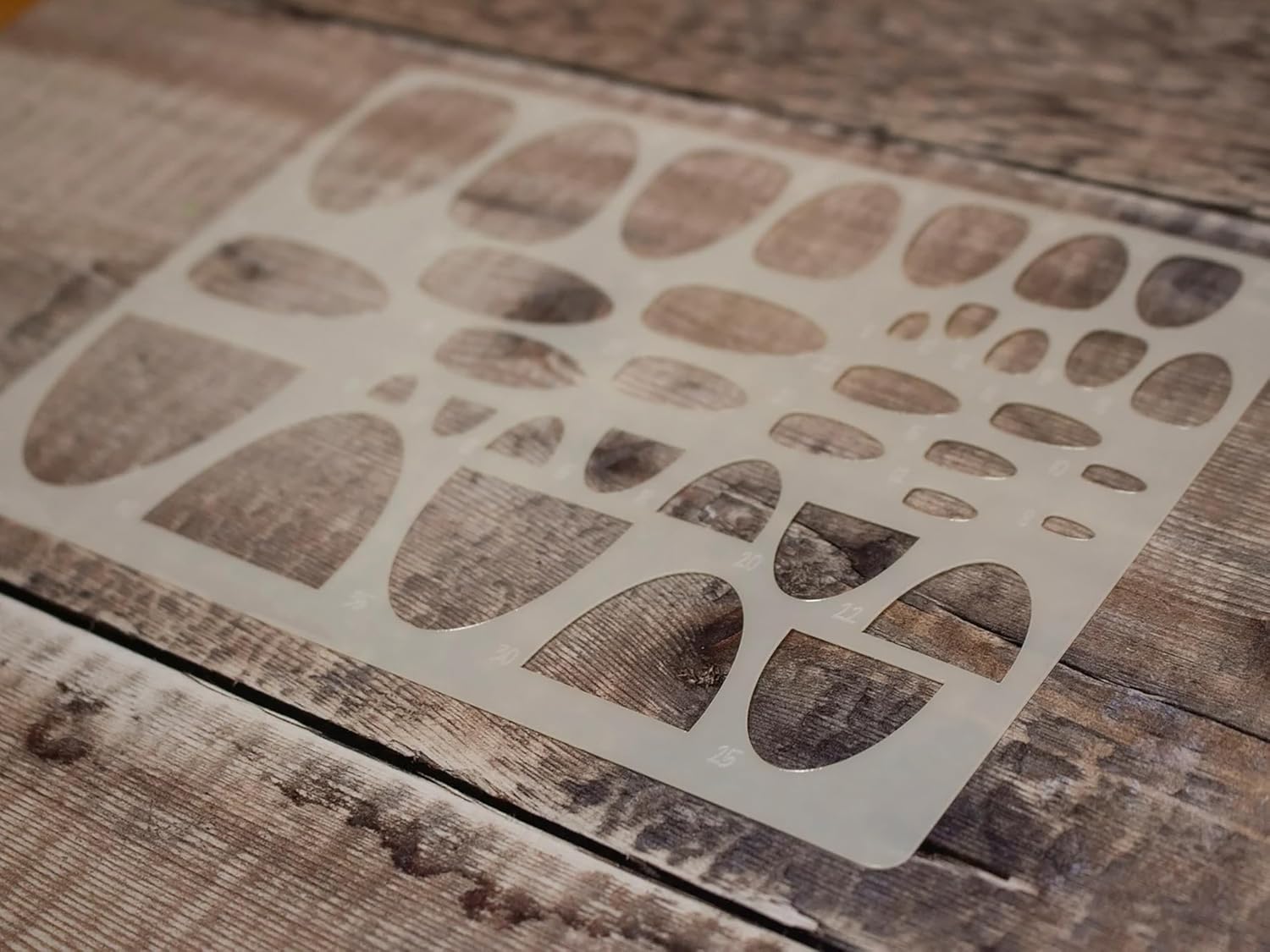 Stencil with stone pattern on a wooden surface