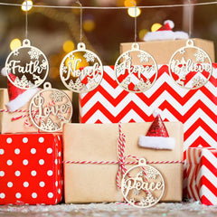 Decorative Christmas ornaments with motivational phrases on a festive background with presents.