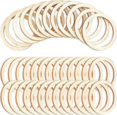 Multiple wooden rings stacked on a white background