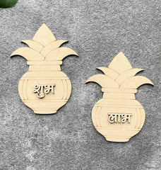 Two wooden pineapple-shaped decorations with engraved text on a gray surface