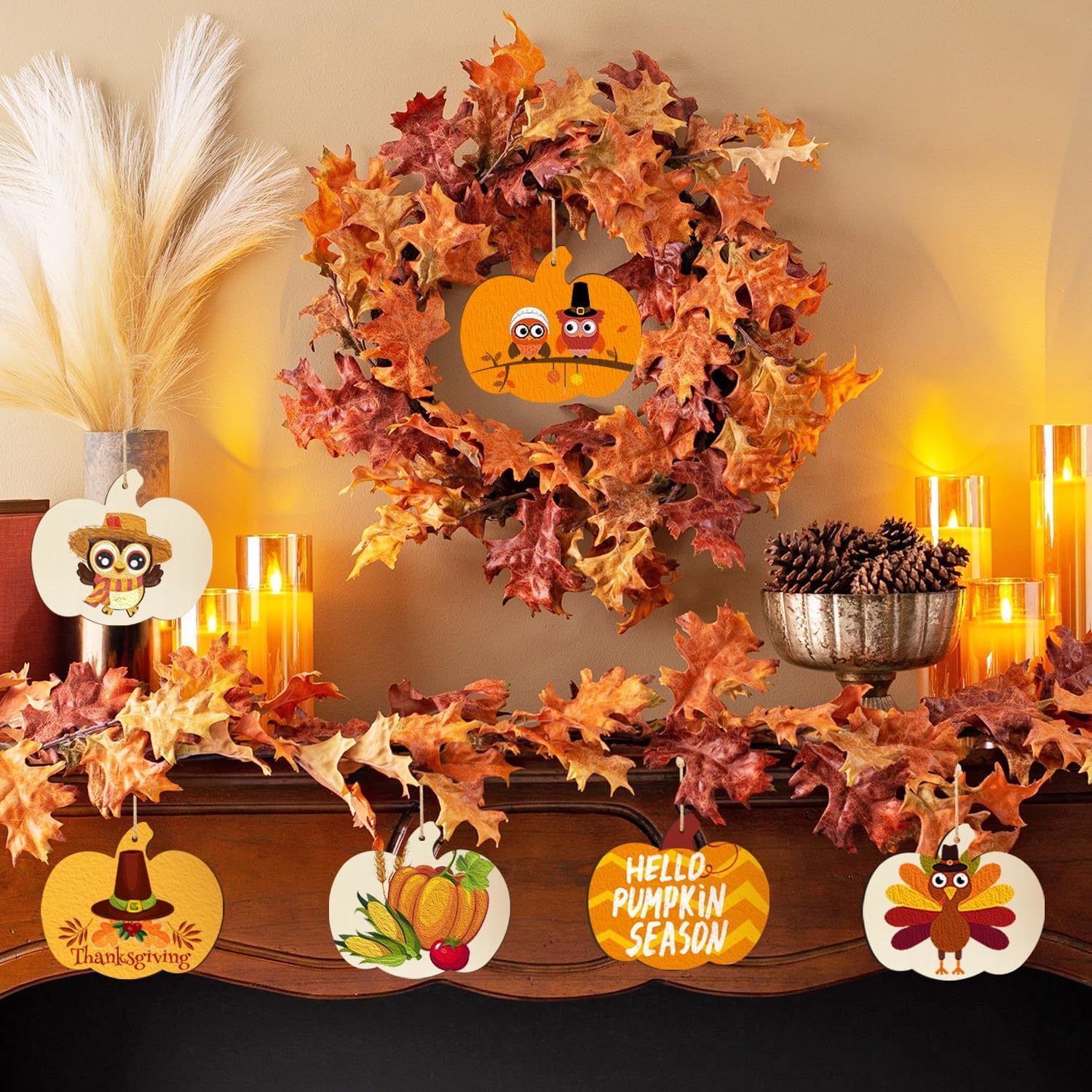 Decorative Thanksgiving mantel with wreath, signs, and candles.