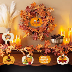 Decorative Thanksgiving mantel with wreath, signs, and candles.