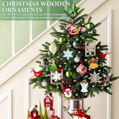 Decorative Christmas tree with various ornaments against a white wall.