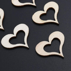 Wooden heart shapes on a black background
