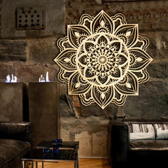 Decorative mandala wall art on a stone wall in a living room setting.